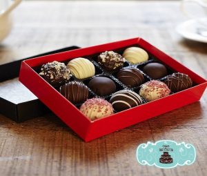 A box of chocolates on top of a table.