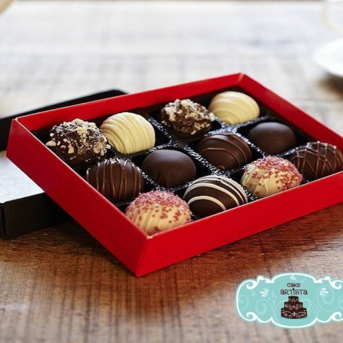 A box of chocolates on top of a table.