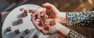 A person holding some chocolate in their hands