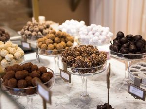 A table filled with lots of different types of truffles.