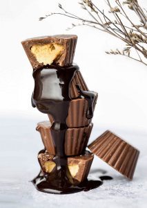 A stack of chocolate bars with one being eaten.