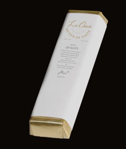 A white box with gold trim and the name of the brand