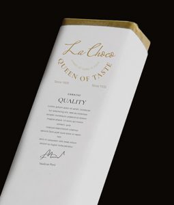 A white box with gold trim and the name of the brand