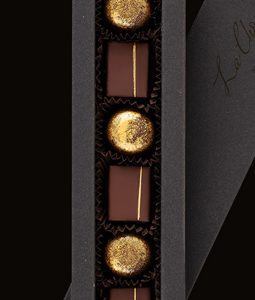 A close up of chocolates in a box