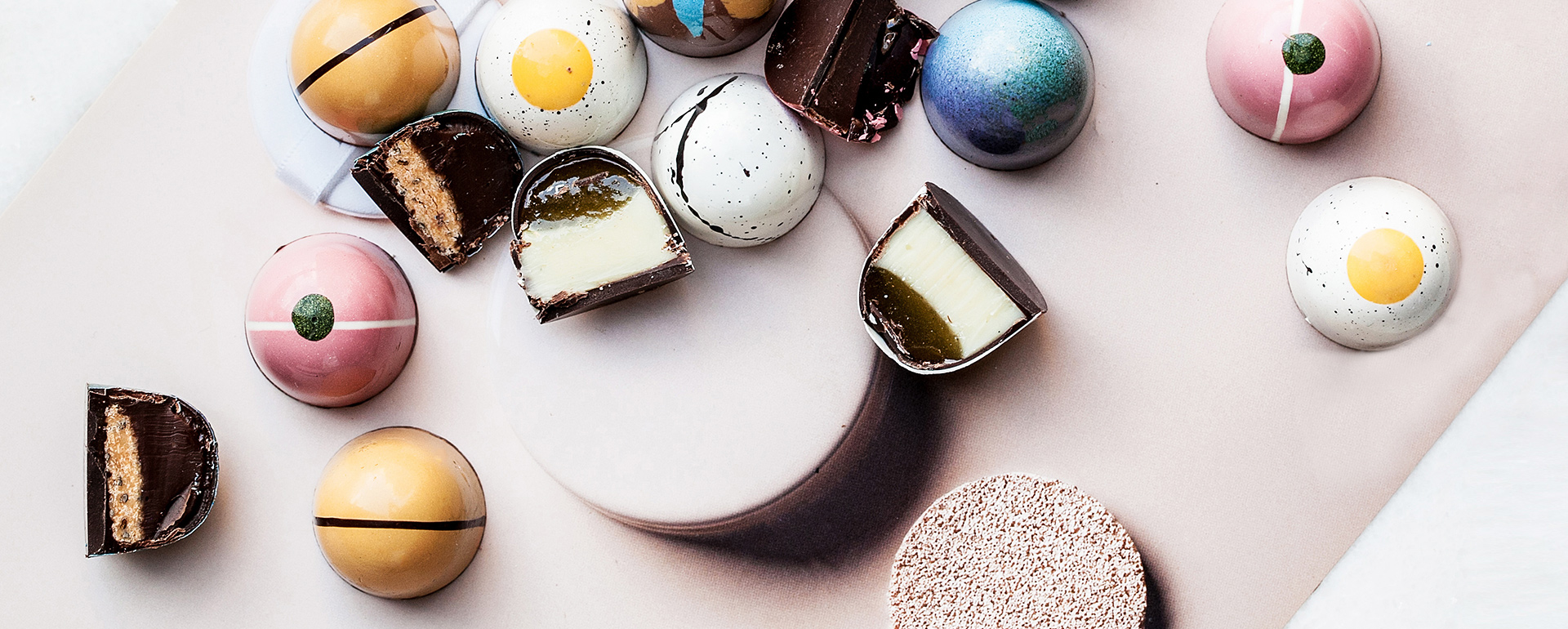 A table topped with different types of desserts.