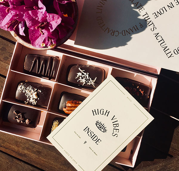 A box of chocolates sitting on top of a table.