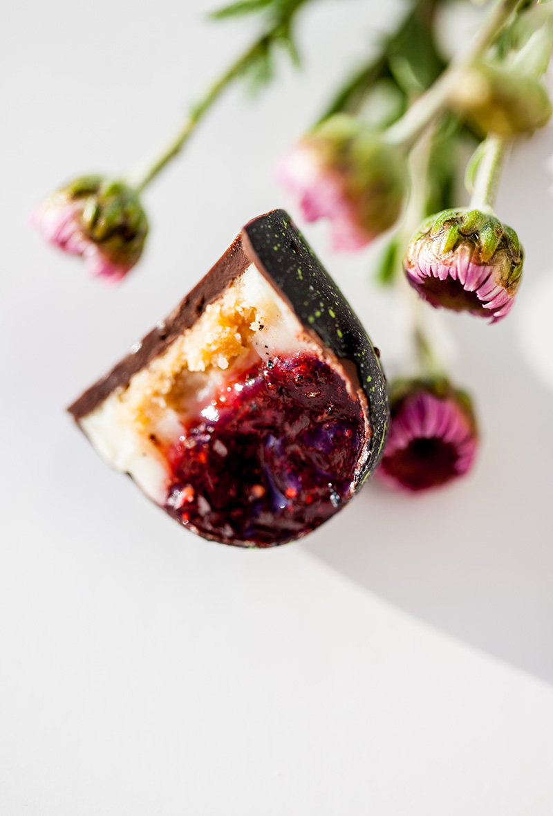 A piece of cake with fruit on top.