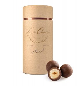 A brown tube with two chocolate covered nuts.