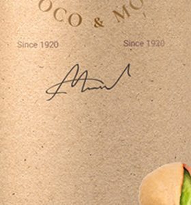 A close up of the signature on a bottle