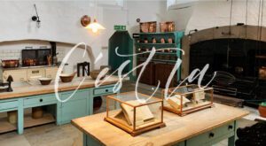 Historic kitchen with copper utensils and displays.