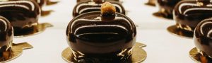 A close up of some chocolate cakes on a plate