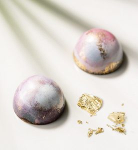 Two balls of gold and a piece of paper