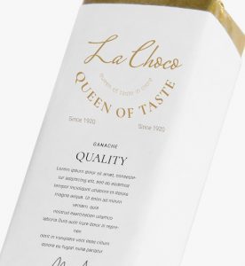 A white box with gold lettering and the words " le chaco queen of taste."