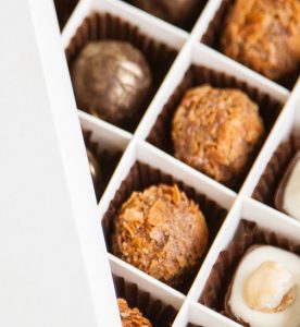A close up of chocolates in a box
