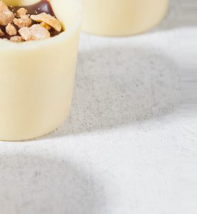A close up of two cups with food inside