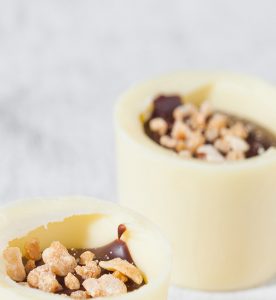 A close up of two cups with food inside