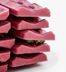 A stack of pink chocolate bars on top of each other.