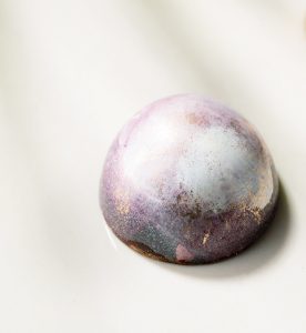 A close up of a ball on top of a table.