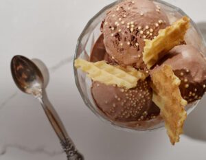 Chocolate ice cream with waffle toppings.