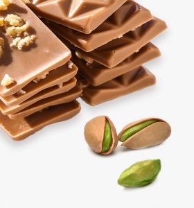 A pile of chocolate and nuts next to each other.
