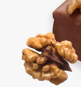 A close up of some nuts on top of chocolate