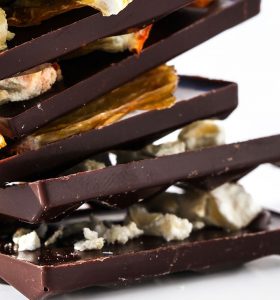 A stack of chocolate bars with different toppings.