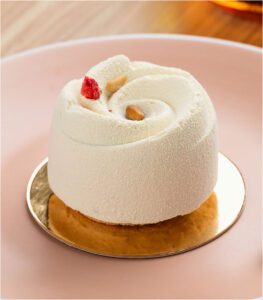 Delicate white cake with berry topping.