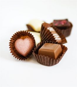 A close up of several chocolates on a table