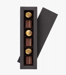 A box of chocolates with four different flavors.