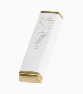 A white box with gold trim and a label.