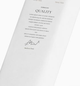 A white paper with the words quality written on it.