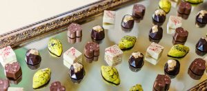A table with many different types of chocolates.