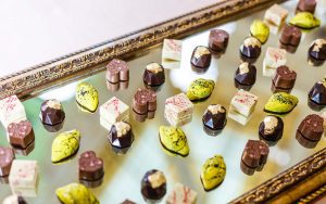 A tray of chocolates on top of a table.