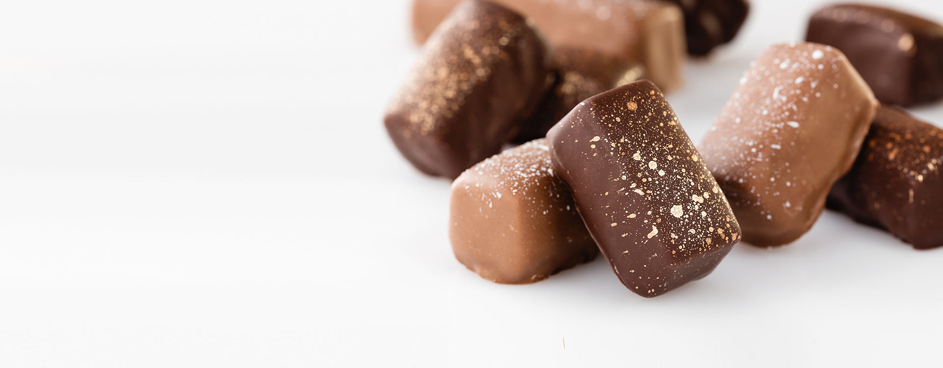 A close up of some chocolate covered candies