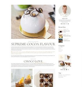 A white cake with chocolate on top of it.
