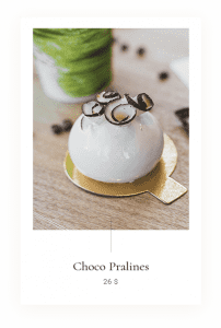 A pastry with chocolate and glasses on top of it.