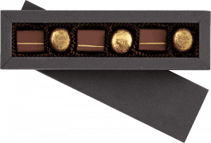 A box of chocolates with gold foil in it.