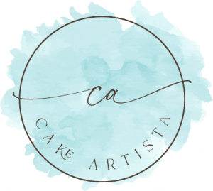 A blue circle with the word cake artista written in it.