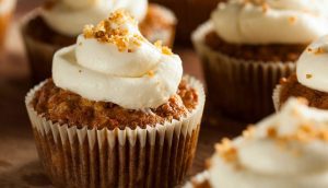 A close up of some cupcakes with white frosting