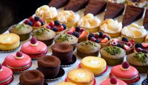 A table filled with lots of different types of desserts.
