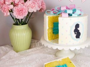 A cake that has been cut into the shape of a present.