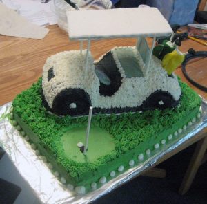 A cake that looks like a golf cart.