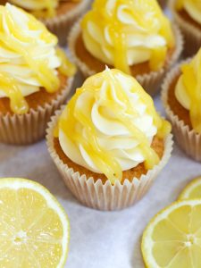 A close up of cupcakes with lemon icing