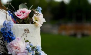A close up of the cake with flowers on it