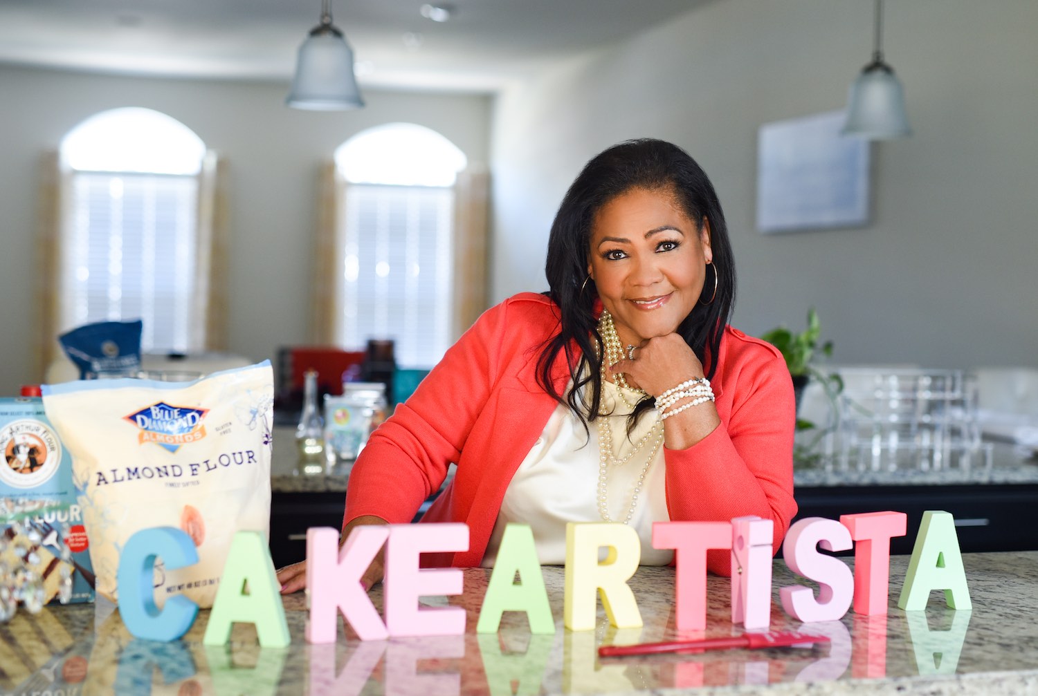 A woman sitting at the table with cake