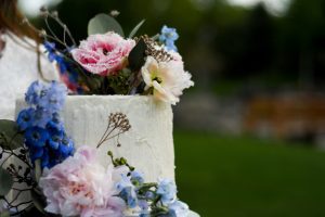 A close up of the top of a cake with flowers on it