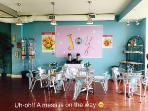 A room with many chairs and tables in it