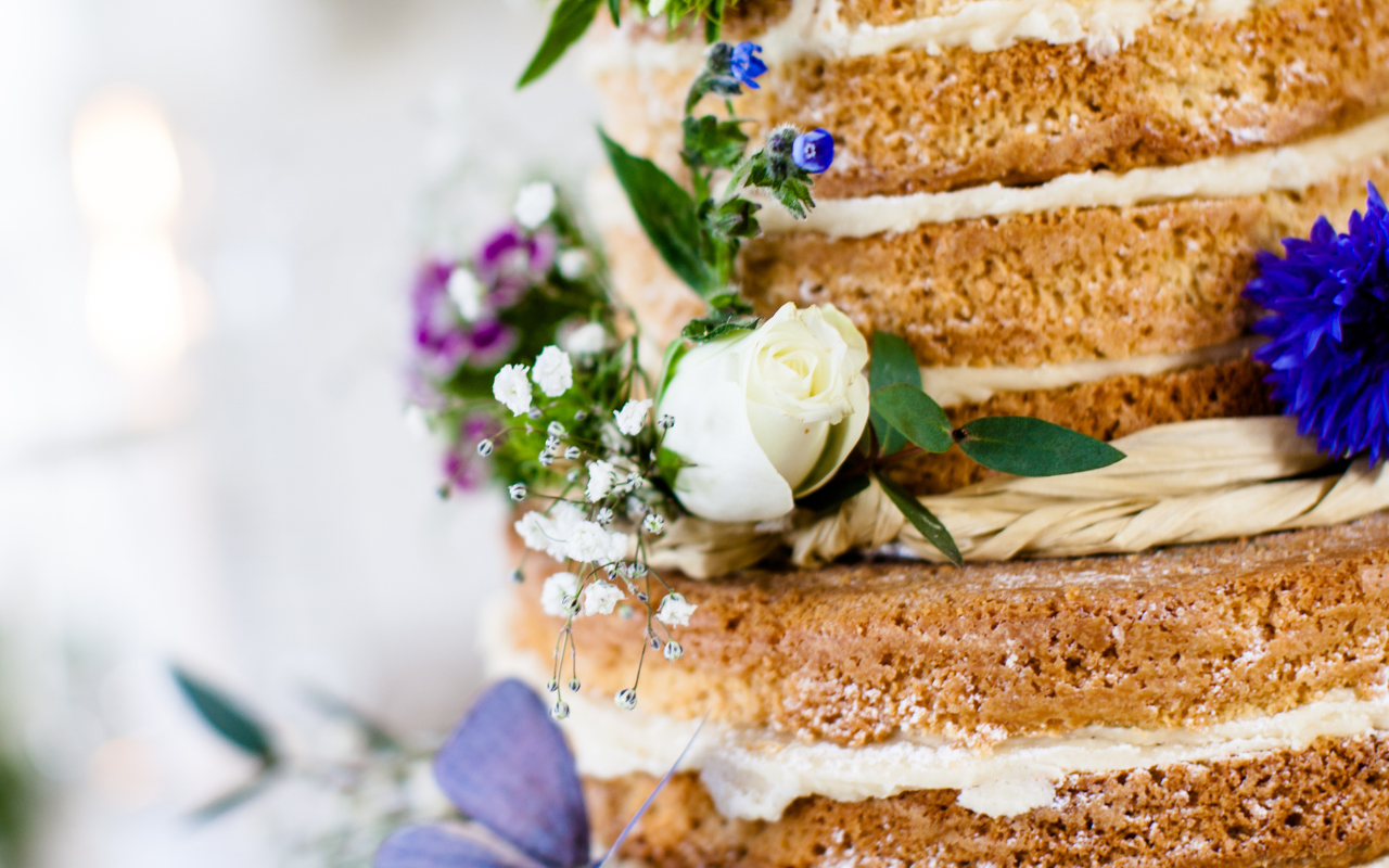 A close up of the cake with flowers on it