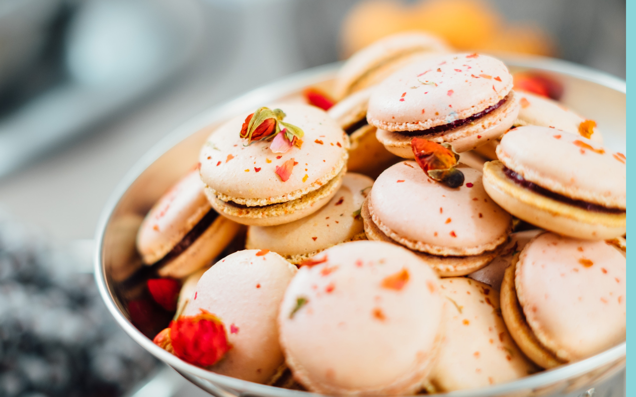 A bowl of cookies with strawberries and other toppings.