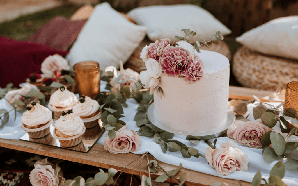 A white cake with flowers on top of it.